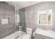 Modern bathroom featuring a shower-over-tub and gray marble accents at 10633 Tinta Ln, Las Vegas, NV 89144