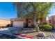 Charming single-Gathering home with neutral tones, two-car garage, manicured landscaping and mature shade tree at 10633 Tinta Ln, Las Vegas, NV 89144