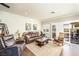 Comfortable living room featuring a leather sofa, recliner, and access to an outdoor seating area at 10633 Tinta Ln, Las Vegas, NV 89144