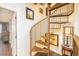 Unique home decor with gold metal spiral staircase leading to another floor with natural light at 10633 Tinta Ln, Las Vegas, NV 89144