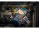 Aerial view of backyard oasis featuring a sparkling swimming pool, mature landscaping, and privacy at 10725 Bernini Dr, Las Vegas, NV 89141