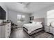Bright, airy bedroom features a comfortable queen bed, a stylish rug, and neutral decor at 10725 Bernini Dr, Las Vegas, NV 89141
