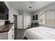 Well-lit bedroom features wood floors, a comfortable queen bed, neutral decor, and ample closet space at 10725 Bernini Dr, Las Vegas, NV 89141