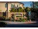Community entrance with elegant stone signage, manicured landscaping, and well-maintained surroundings at 10725 Bernini Dr, Las Vegas, NV 89141