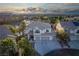 Stunning two-story home featuring a three-car garage, balcony, and well-manicured landscaping in a desirable neighborhood at 10725 Bernini Dr, Las Vegas, NV 89141