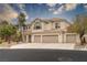 Inviting two-story home with a well-maintained yard, three-car garage, and a neutral stucco exterior at 10725 Bernini Dr, Las Vegas, NV 89141