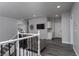 Bright hallway with wood floors, white trim, and a staircase leading to the upper level at 10725 Bernini Dr, Las Vegas, NV 89141