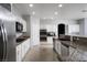 Spacious kitchen with stainless steel appliances, granite countertops, and ample cabinet space at 10725 Bernini Dr, Las Vegas, NV 89141