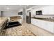 Beautiful, expansive kitchen featuring granite countertops, stainless appliances, and breakfast bar seating at 10725 Bernini Dr, Las Vegas, NV 89141