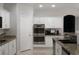 Well-appointed kitchen featuring granite countertops, stainless steel appliances, and ample cabinet storage at 10725 Bernini Dr, Las Vegas, NV 89141