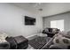 Cozy living room featuring comfortable seating, a modern TV, and stylish decor at 10725 Bernini Dr, Las Vegas, NV 89141