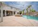 Expansive backyard oasis with pool, waterfall features, and well-manicured landscaping at 10725 Bernini Dr, Las Vegas, NV 89141