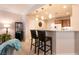 Stylish kitchen bar with pendant lighting and seating, perfect for entertaining and casual dining at 11253 Piper Peak Ln, Las Vegas, NV 89138