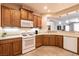 Functional kitchen with a gas range, microwave, and dishwasher, offering a practical cooking space at 11253 Piper Peak Ln, Las Vegas, NV 89138