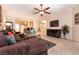 Bright and airy living room with open layout, comfortable seating, and natural light at 11253 Piper Peak Ln, Las Vegas, NV 89138