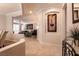 Open-concept living room showcasing stylish decor, tile flooring, and an inviting seating area at 11253 Piper Peak Ln, Las Vegas, NV 89138