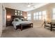 Inviting main bedroom featuring plush carpeting, shuttered windows, and a decorative accent wall at 11253 Piper Peak Ln, Las Vegas, NV 89138