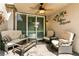Cozy patio featuring a comfortable seating area with a sofa, chairs, and a coffee table at 11253 Piper Peak Ln, Las Vegas, NV 89138