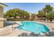 Beautiful pool with ample seating and well-maintained surroundings, perfect for recreation at 11253 Piper Peak Ln, Las Vegas, NV 89138