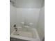 Bathroom featuring a white tiled shower and tub combination at 1209 Equator Ave, North Las Vegas, NV 89032