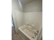 Bathroom featuring a white tiled shower and tub combination at 1209 Equator Ave, North Las Vegas, NV 89032