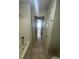 Bathroom leading to bedroom featuring tiled floors and a bath tub at 1209 Equator Ave, North Las Vegas, NV 89032