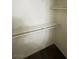 Walk in closet featuring white shelving and dark wood flooring at 1209 Equator Ave, North Las Vegas, NV 89032