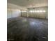 Spacious two car garage with concrete floor at 1209 Equator Ave, North Las Vegas, NV 89032