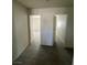 Neutral hallway featuring modern flooring and white paint throughout home at 1209 Equator Ave, North Las Vegas, NV 89032
