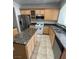 Kitchen with island, granite countertops, and stainless steel appliances at 1209 Equator Ave, North Las Vegas, NV 89032