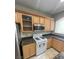 Kitchen with island, stainless steel appliances, and granite countertops at 1209 Equator Ave, North Las Vegas, NV 89032