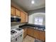 Well-lit kitchen featuring granite countertops, island, and stainless steel appliances at 1209 Equator Ave, North Las Vegas, NV 89032