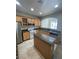 Kitchen with island, stainless steel appliances and granite countertops at 1209 Equator Ave, North Las Vegas, NV 89032