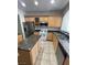Kitchen featuring stainless steel appliances, island, and granite countertops at 1209 Equator Ave, North Las Vegas, NV 89032