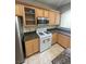 Spacious kitchen featuring ample cabinetry and a stainless steel microwave at 1209 Equator Ave, North Las Vegas, NV 89032