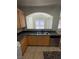 Kitchen with granite countertops and a pass-through to the living room at 1209 Equator Ave, North Las Vegas, NV 89032