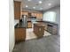 Kitchen with island, stainless steel appliances, and granite countertops at 1209 Equator Ave, North Las Vegas, NV 89032