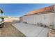 A concrete patio and gravel yard offer a blank canvas to design your dream backyard oasis at 1319 Highland Ct, Boulder City, NV 89005