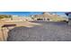 Expansive, low-maintenance gravel backyard with views of surrounding homes and landscape at 1319 Highland Ct, Boulder City, NV 89005