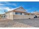 Back view of a single story home features a tile roof and low maintenance gravel yard at 1319 Highland Ct, Boulder City, NV 89005