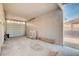 Bright and spacious garage with a roll up door and plain concrete flooring, ready for use at 1319 Highland Ct, Boulder City, NV 89005