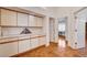 Hallway with wooden floors and beautiful built-in storage cabinets at 1319 Highland Ct, Boulder City, NV 89005