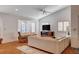 Bright living room with vaulted ceilings, bay window, neutral sofa, wood floors, and ceiling fan at 1319 Highland Ct, Boulder City, NV 89005