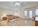 Spacious main bedroom with tile floors, vaulted ceiling, and an ensuite bathroom with natural light at 1319 Highland Ct, Boulder City, NV 89005