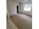 Neutral bedroom features bright window, plush carpet, and closet space at 1540 Sabatini Dr, Henderson, NV 89052