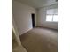 Neutral bedroom features bright window, plush carpet, and closet space at 1540 Sabatini Dr, Henderson, NV 89052