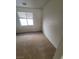 Neutral bedroom features bright window, plush carpet, and a closet at 1540 Sabatini Dr, Henderson, NV 89052