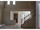 Inviting entryway with staircase and open layout to the living areas, offering a bright and airy feel at 1540 Sabatini Dr, Henderson, NV 89052