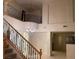 Elegant entryway with a staircase leading to an upper level balcony overlooking the living area at 1540 Sabatini Dr, Henderson, NV 89052