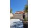 Attractive single-Gathering home with a well-kept lawn, spacious driveway and attached garage at 1540 Sabatini Dr, Henderson, NV 89052